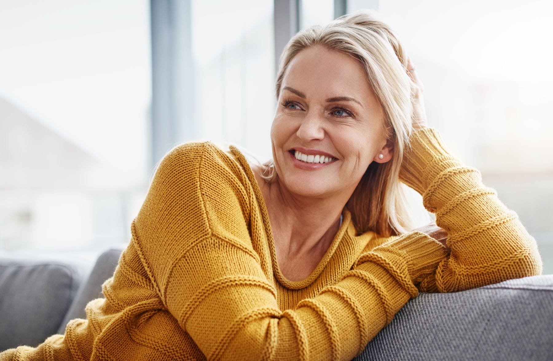 Shot of an attractive mature woman relaxing on the sofa at home.