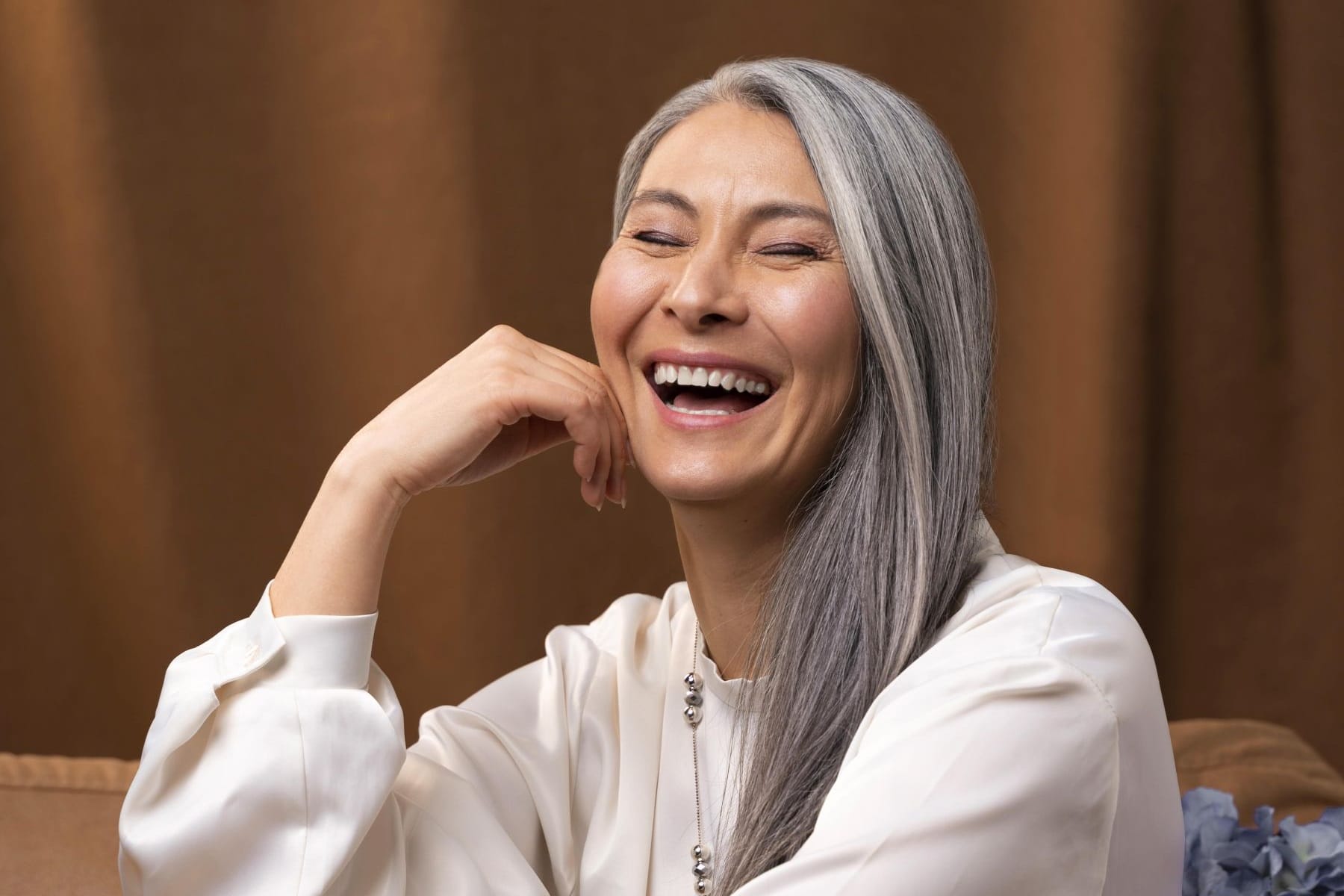 beautiful-senior-woman-portrait-posing-couch-18001200